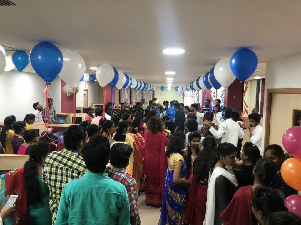 CIPL colleagues gathered on a decorated office floor during a team celebration